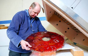 Irish glass artist Keith Sheppard pictured working with red glass in his contemporary glassware studio, Glass Art Ireland, located  in County Armagh in Northern Ireland