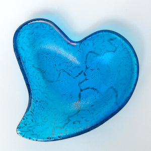 Blue heart shaped glass bowl in iridised rainbow on turquoise - contemporary glassware made in Ireland by Glass Art Ireland. Photo reference 4002