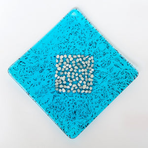 Square pebble plate in turquoise blue transparent with french vanilla frit - contemporary glassware made in Ireland by Glass Art Ireland. Photo reference 4026